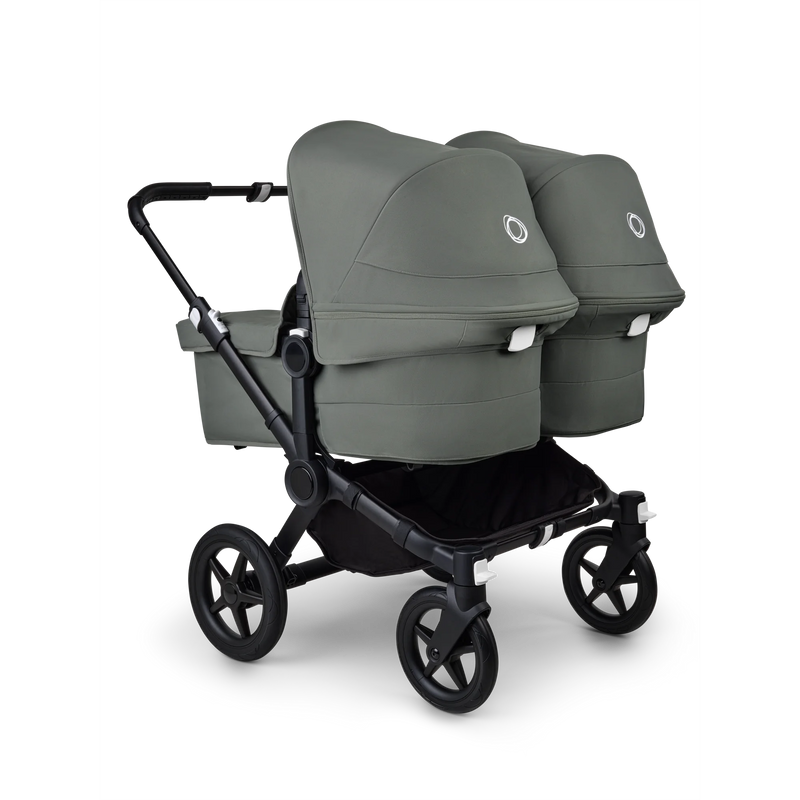 Baksidan av barnevognen Bugaboo Donkey 5 Twin til tvillingar i skovgrøn med två liftar