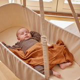 Baby that lies and sleeps in cradle on stand with cradle motor from Membantu