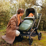 Children in THERMOLITE® Multifunktionell Footmuff from Bugaboo in forest green